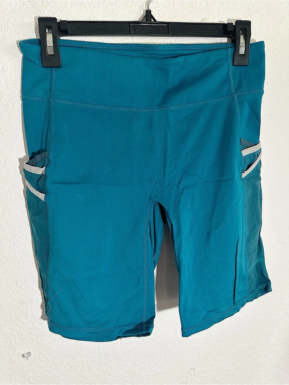 Fabletics Trinity Mid Rise Pocket Biker Shorts in Azure/Green Mist $59.95